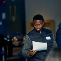 International Anchor Allies Winter 2026 First Mixer - a male student glances through his document